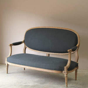19c French sofa in charcoal linen with restoration period fluted detail