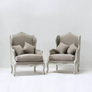 Pair of 19th Century French bergeres chairs with carved detail muted linen reupholstery