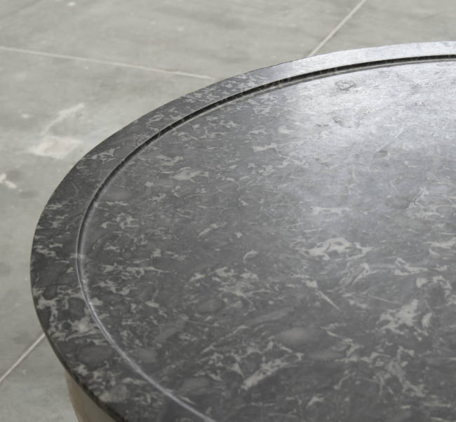 the bevelled edged and veined marble top