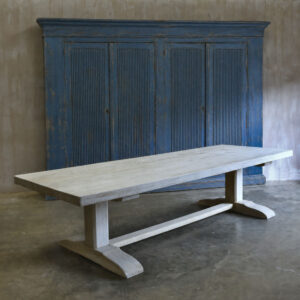 A solid bespoke oak trestle table with a bleached finish