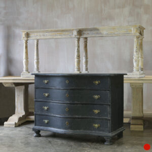 An early Dutch serpentine commode in a blue black paint with light distressing