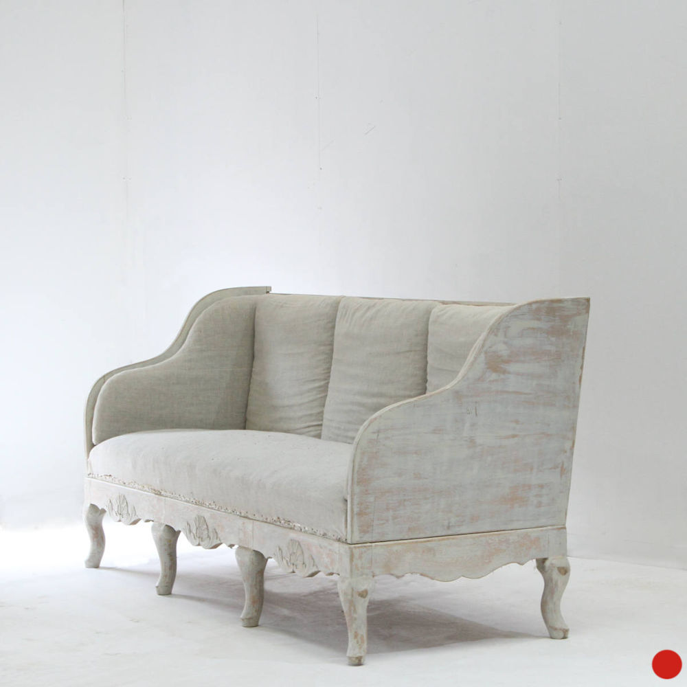 A stylish Swedish sofa in the rococo style with elegant cabriole feet and carved detail