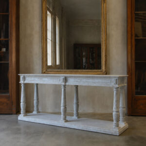 A painted draper's table or console with storage shelf and turned legs