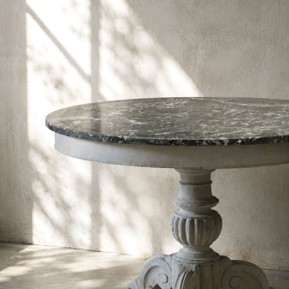 The marble top seen at a close angle showing the edge